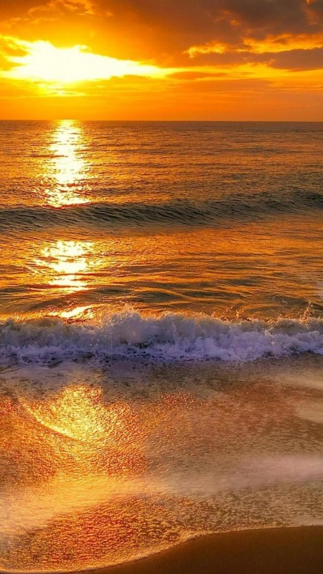 海岸边的夕阳象征着希望图片壁纸