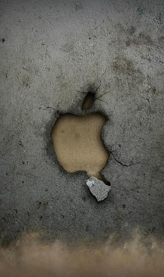 墙壁上破损的苹果标志图片