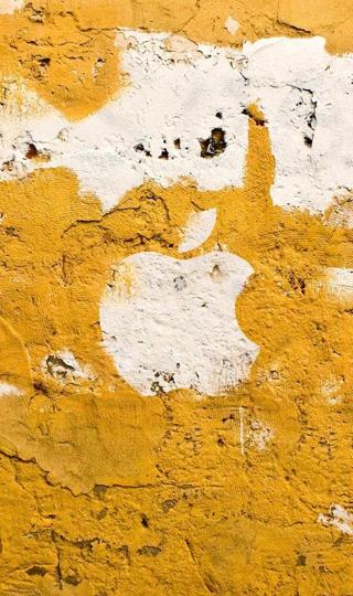 黄色墙壁上的苹果标志壁纸图片