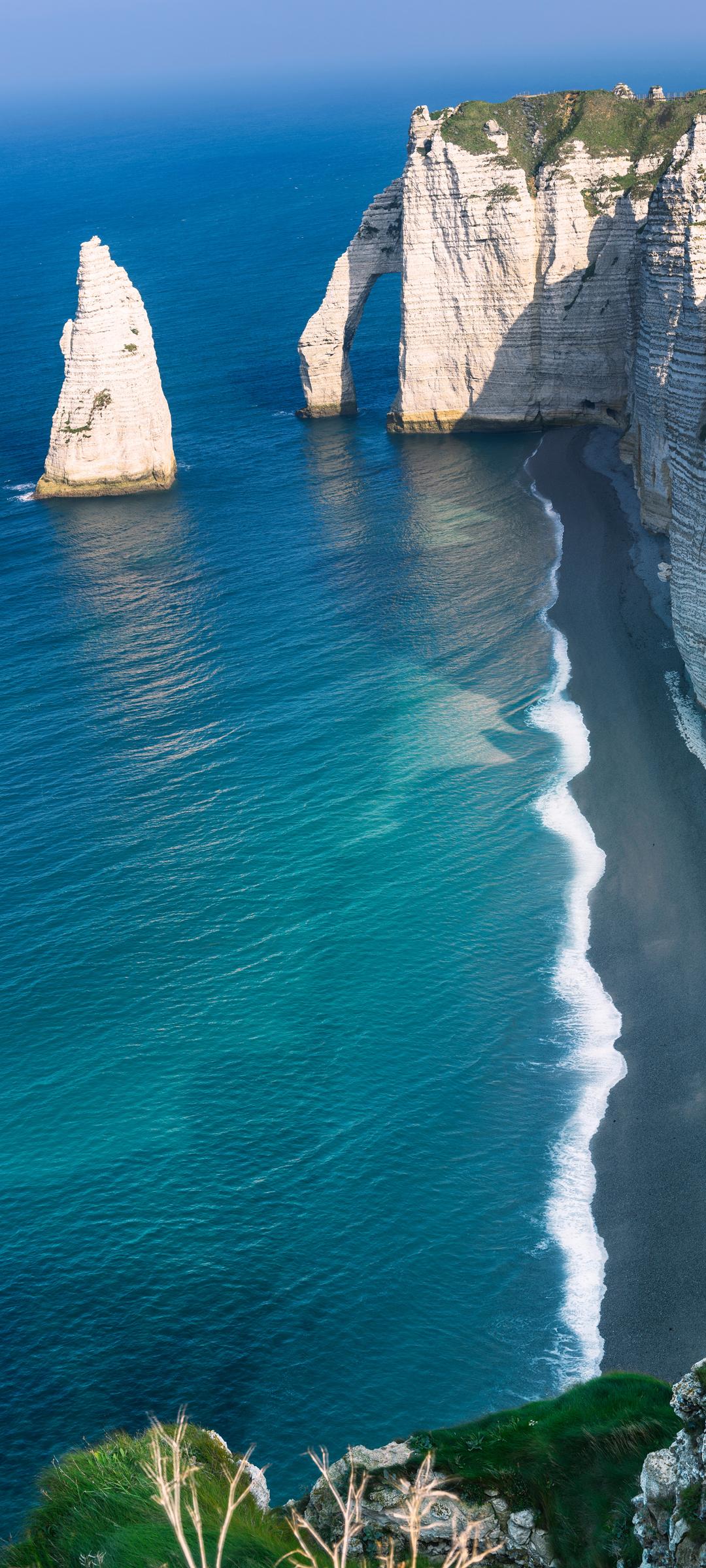 海边岩石蓝色大海风景手机壁纸